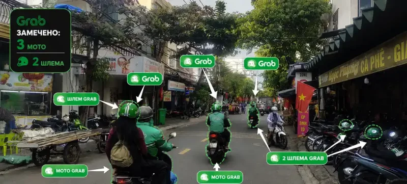 На улице Дананга отмечены водители и шлемы Grab, показывающие, насколько популярен сервис во Вьетнаме
